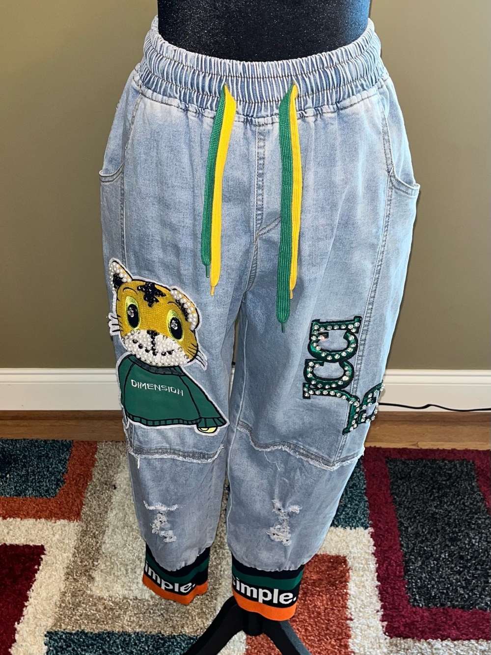 Light Wash Denim Joggers with Tiger Patch and Green Drawstring